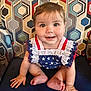 Emmy joined the competition — help win amazing prizes! baby, child, smile, happy, sitting, blue, cushion, patterned_background, geometric_pattern, clothing, stars, frills, cute, indoor, portrait, person, face, hand, foot, bright