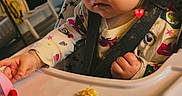 Jourdyn joined the competition — help win amazing prizes! baby_clothes, cereal, child, curiosity, curly_hair, cute, expression, face, feeding, food, hand, high_chair, indoor, light, room, seat_belt, table, toddler, window, young_child
