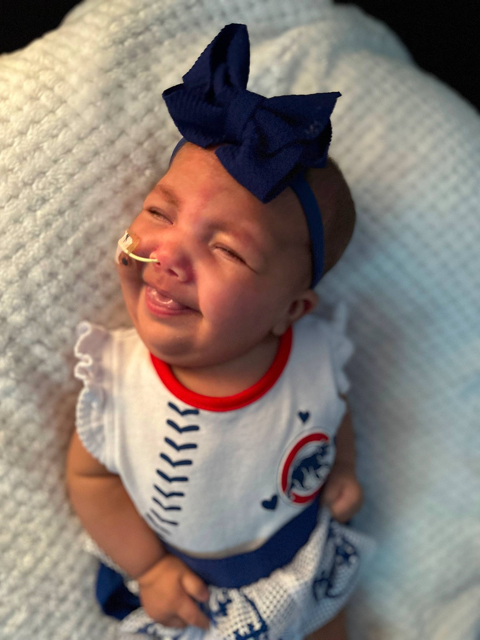 Ailani is registered to the contest to win money with this photo: baby, baby_products, baby_toddler_clothing, cap, carmine, cheek, child, costume_accessory, costume_hat, electric_blue, fashion_accessory, fictional_character, happy, hat, headgear, headwear, pattern, person, personal_protective_equipment, sleeve