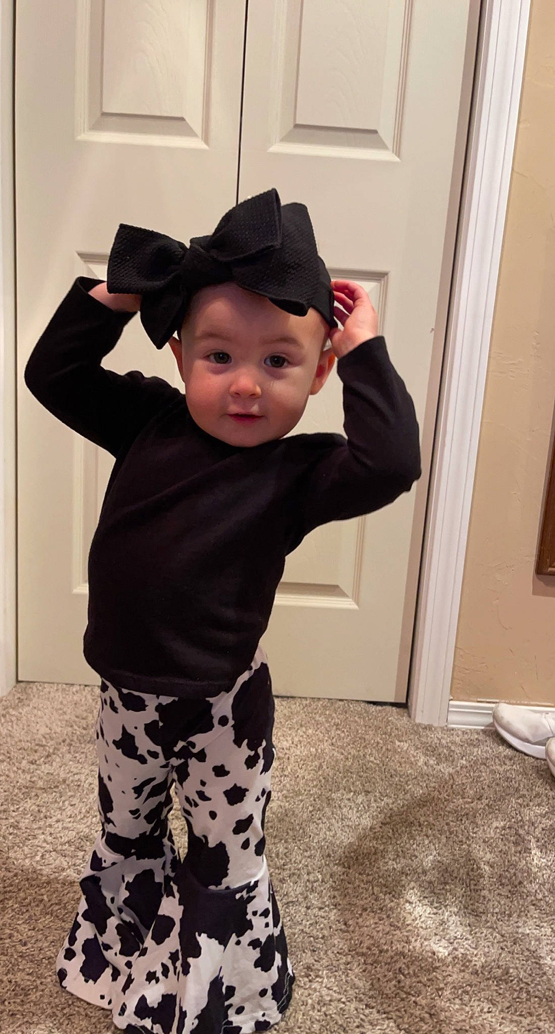 Karley joined the competition — help win amazing prizes! active_pants, baby, baby_toddler_clothing, child, cool, costume_hat, facial_expression, flooring, fun, hairstyle, happy, hat, headwear, outerwear, pattern, person, shoulder, sleeve, standing, sun_hat