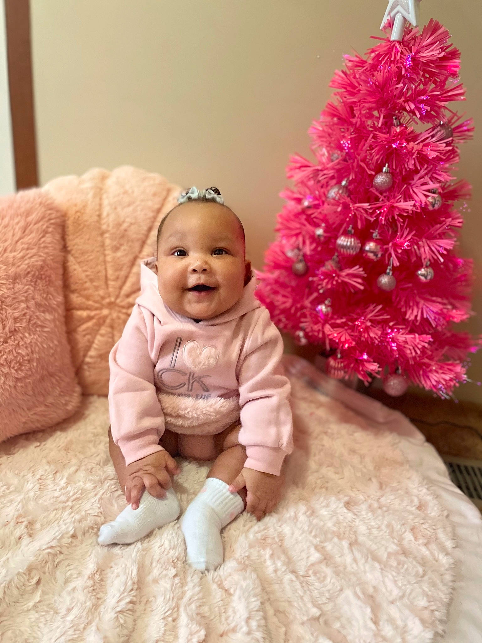 Aviyanna joined the competition — help win amazing prizes! baby, baby_toddler_clothing, beauty, christmas_decoration, christmas_ornament, christmas_tree, evergreen, flooring, holiday, holiday_ornament, joy, ornament, person, pink, plant, purple, skin, smile, textile, toddler