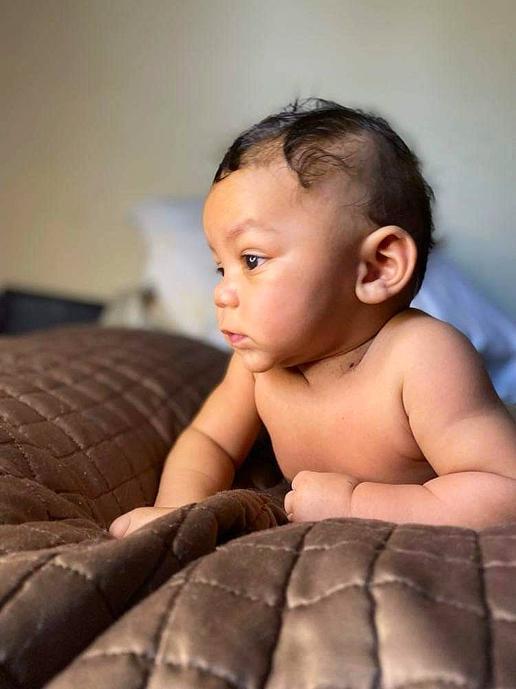 Kashton joined the competition — help win amazing prizes! abdomen, arm, baby, barechested, black_hair, chest, child, comfort, elbow, eye, eyelash, flash_photography, flooring, human_body, human_leg, iris, person, sitting, skin, toddler