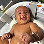 baby, bath, water, foam, happy, smile, skin, bracelet, infant, child, sitting, wet, cute, playful, indoors, tub, foam_bubbles, human, joyful, relaxation