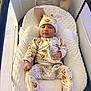 Zion is registered to the contest to win money with this photo: baby, infant, pajamas, halloween, pumpkin, spider_web, baby_nest, crib, playpen, hat, onesie, comfort, cute, child, sleepwear, indoors, resting, portrait, cozy, soft_fabric