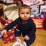 baby, bag, cartoon, celebration, child, christmas, cute, festive, floor, gift_box, holiday, indoor, kitten, pajamas, pouty_face, present, socks, spiderman, toddler, wrapped_present