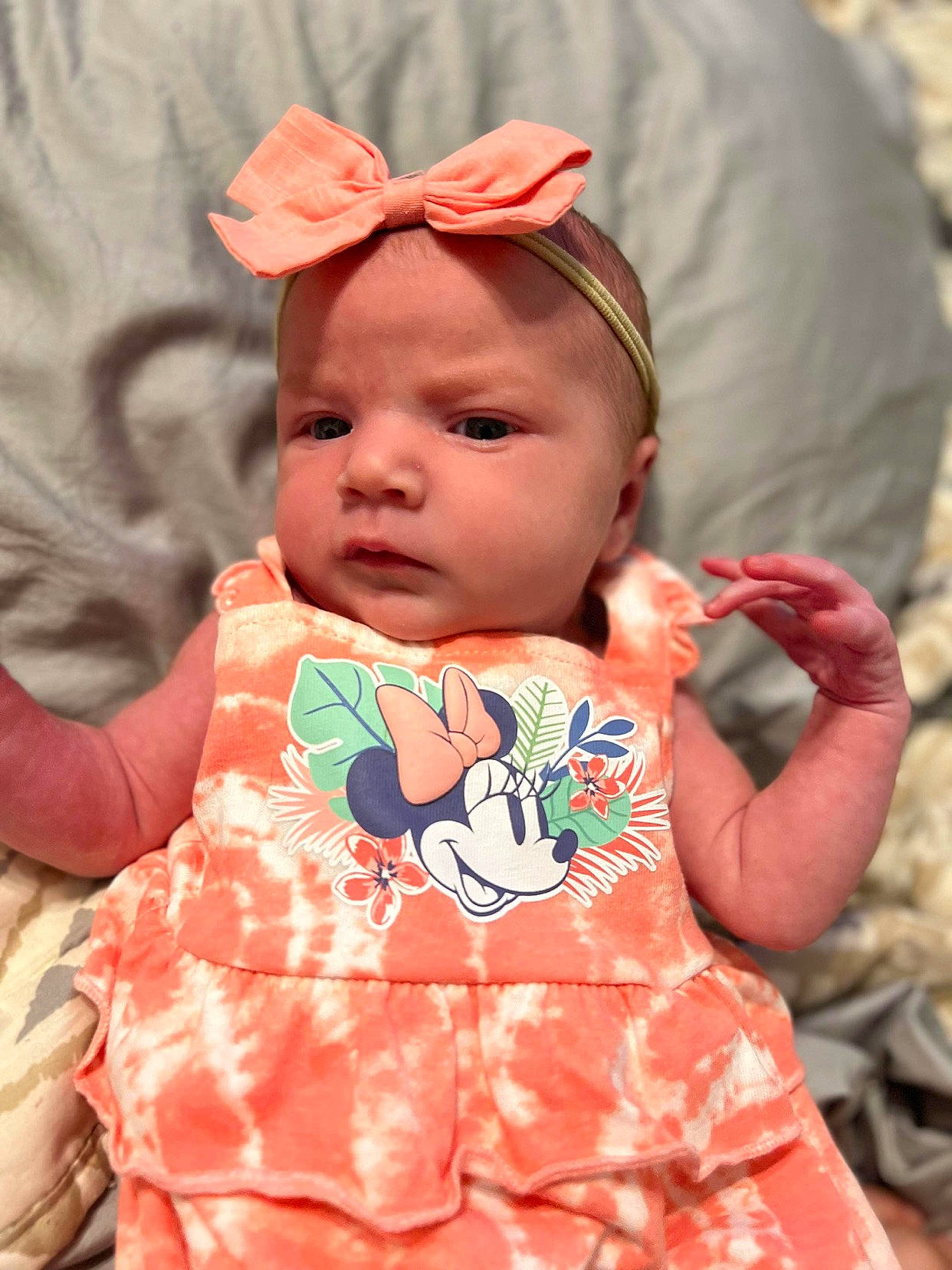 Hadley is registered to the contest to win money with this photo: baby, baby_toddler_clothing, cap, cheek, child, dress, facial_expression, grass, happy, hat, human_body, lip, neck, pattern, peach, person, pink, skin, sleeve, t_shirt