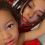 Bleu Enzo Caban joined the competition — help win amazing prizes! child, adult, face, portrait, selfie, indoor, dreadlocks, expression, curious, relaxed, skin, person, closeup, young, casual, together, family, head, arm, red_clothing