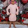 Dalia Ann is registered to the contest to win money with this photo: barefoot, child, cute, decorations, flower_arrangement, fluffy_rug, girl, hair_beads, happy, heart_balloons, holiday, indoor, pink_dress, portrait, posing, red_roses, smiling, standing, valentine_theme, wooden_wall