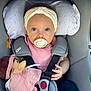 Azélia participe au concours pour gagner de l'argent avec cette photo : baby, blanket, blue_eyes, car_seat, child, child_seat, cushion, cute, doll, hand, headband, indoors, infant, pacifier, pink_clothing, portrait, seatbelt, soft_toy, toddler, toy