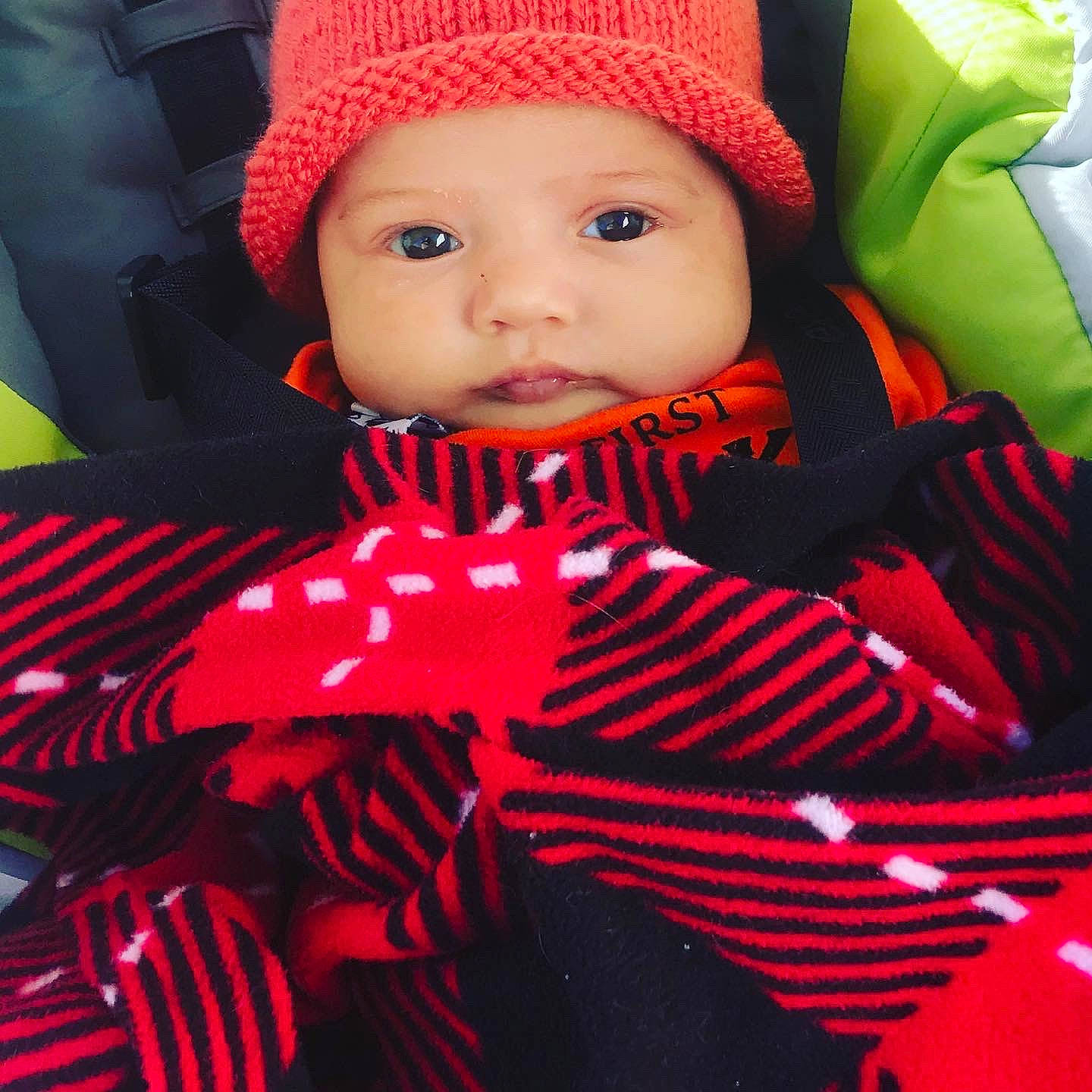 Cecilia is registered to the contest to win money with this photo: baby, baby_products, cheek, child, headgear, knit_cap, person, product, red, textile, toddler