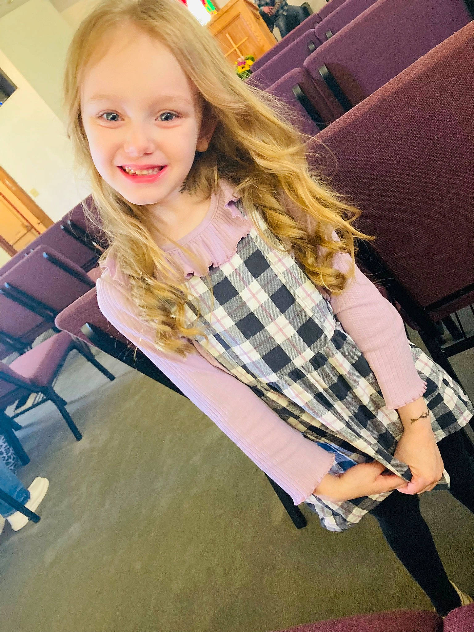 Harmony is registered to the contest to win money with this photo: blazer, blond, chair, collar, electric_blue, fashion_design, flooring, happy, human_leg, joint, joy, knee, long_hair, neck, pattern, person, plaid, sleeve, smile, tartan