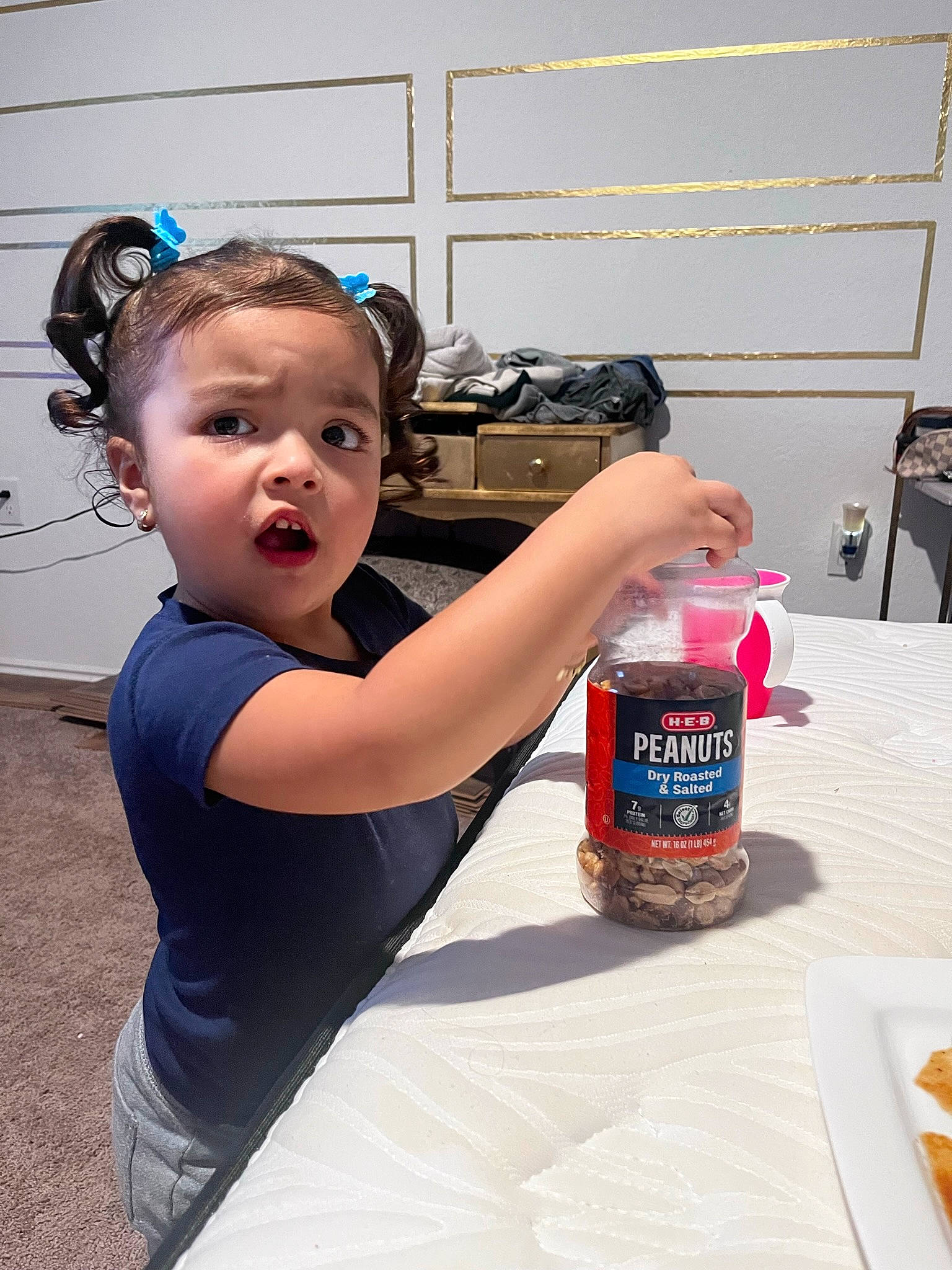 Kehlani is registered to the contest to win money with this photo: bottle, cooking, distilled_beverage, drink, drinking, eyewear, food, fun, glass_bottle, headband, ingredient, jewellery, junk_food, liqueur, person, plastic_bottle, plate, room, surprise, t_shirt