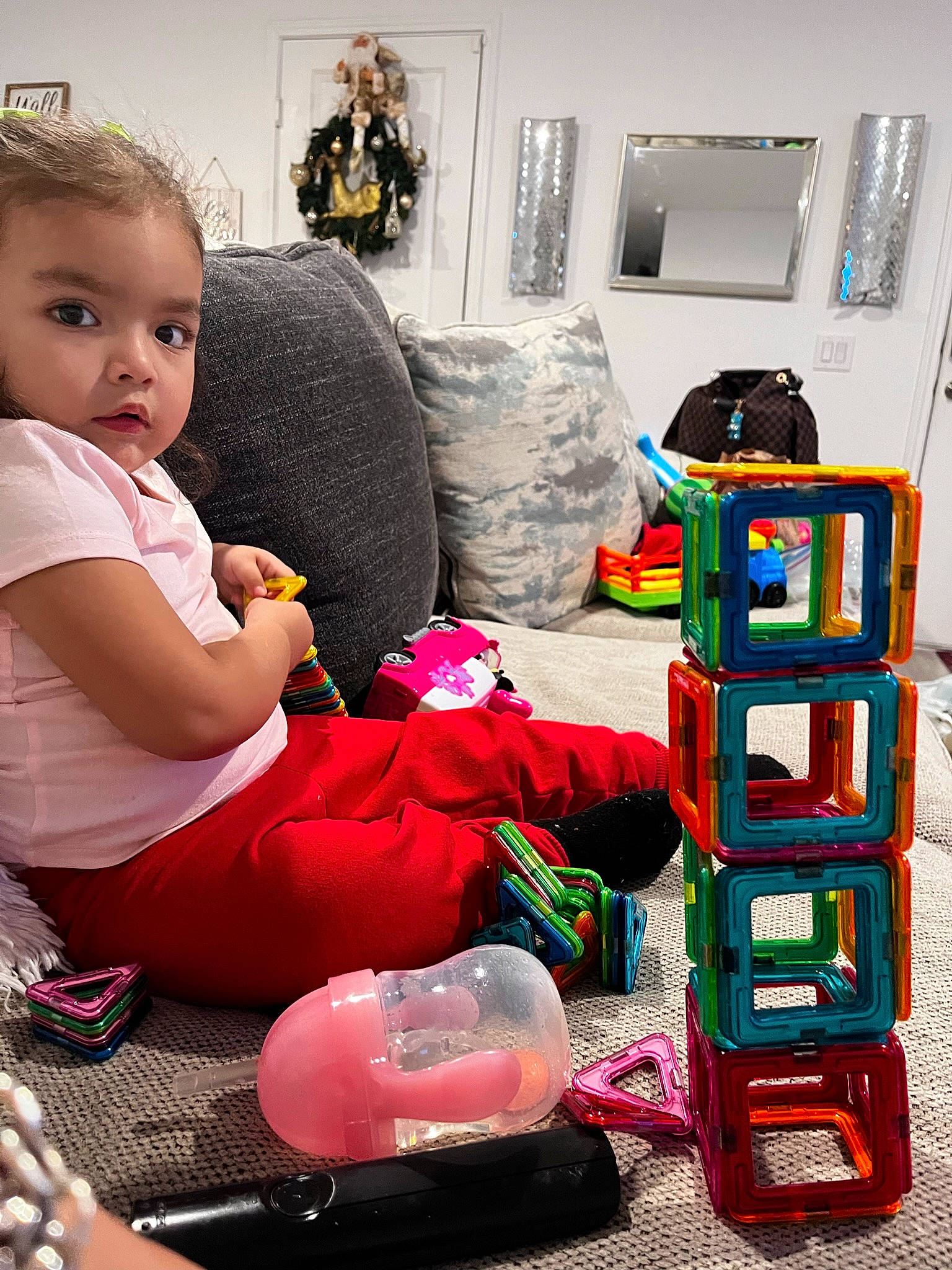 Kehlani is registered to the contest to win money with this photo: baby, baby_toddler_clothing, bag, carmine, child, comfort, flooring, fun, happy, human_leg, lap, luggage_and_bags, magenta, person, picture_frame, play, room, shoe, sitting, toddler