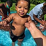 Namari joined the competition — help win amazing prizes! toddler, child, pool, water, summer, outdoor, sunlight, grass, swimming, holding_hands, play, goggles, adult, family, happy, fun, skin, shorts, nature, people