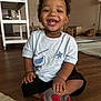 Namari joined the competition — help win amazing prizes! toddler, child, smiling, sitting, indoor, floor, shirt, shorts, socks, wooden_floor, furniture, toy, happy, cute, person, young_child, home, playroom, casual_clothing, portrait