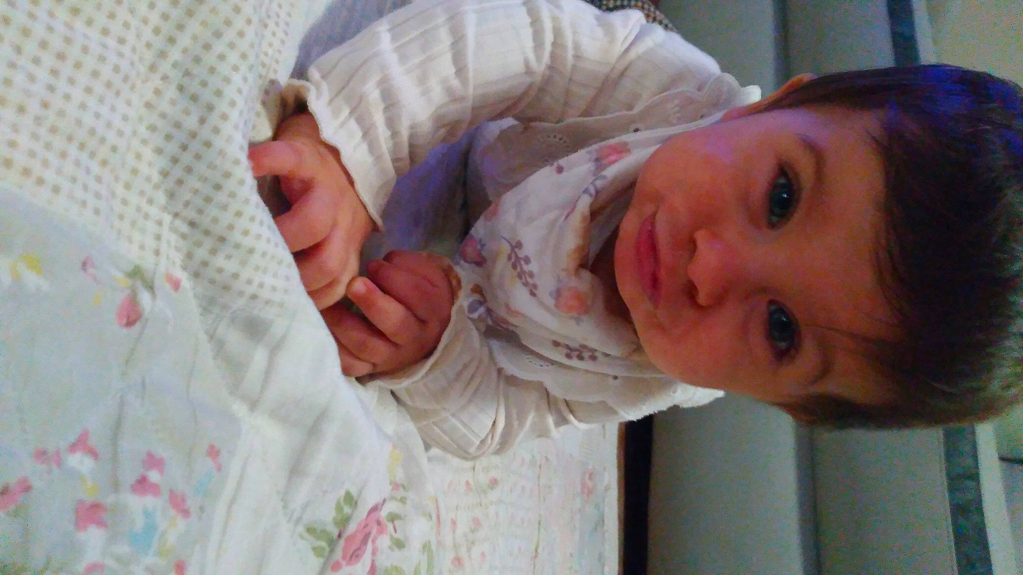 Emma Charlotte participe au concours pour gagner de l'argent avec cette photo : baby, baby_toddler_clothing, cheek, child, comfort, eye, eyelash, happy, iris, linens, lip, nail, nose, pattern, person, room, skin, smile, thumb, toddler