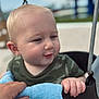 Carter joined the competition — help win amazing prizes! toddler, child, swing, outdoor, hand, blue_cloth, blonde_hair, curious, face, holding, playground, person, baby, clothing, camouflage, smile, daylight, skin, metal, background_blur