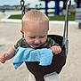 Carter joined the competition — help win amazing prizes! toddler, child, swing, playground, blue_cloth, bucket_swing, blonde_hair, shorts, green_shirt, happy, smiling, outdoor, daylight, sand, park, metal_chains, fun, cute, young_child, leisure