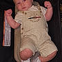 baby, infant, child, overalls, tommy_hilfiger, sneakers, white_shoes, cushion, baby_seat, clothing, cute, chubby, indoor, portrait, face, person, footwear, fashion, young_child, relaxing