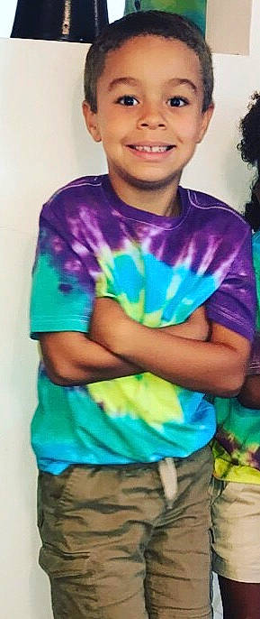 Corbin is registered to the contest to win money with this photo: aqua, blue, child, clothing, cool, dye, electric_blue, joy, male, neck, person, purple, sleeve, smile, t_shirt, toddler, top, turquoise