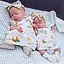 Luna And Lyla is registered to the contest to win money with this photo: baby, blanket, closeup, cute, dress, footwear, hand_holding, headband, indoors, infant, matching_outfits, newborn, peaceful, portrait, resting, sleeping, sock, soft_texture, twins, white