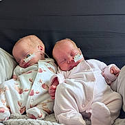 Luna And Lyla joined the competition — help win amazing prizes! baby, newborn, sleeping, infant, onesie, medical_tube, blanket, cozy, cute, peaceful, child, toddler, face, pink, white, pattern, rest, bed, soft, healthcare