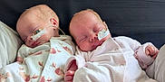 Luna And Lyla joined the competition — help win amazing prizes! baby, bed, blanket, child, cozy, cute, face, healthcare, infant, medical_tube, newborn, onesie, pattern, peaceful, pink, rest, sleeping, soft, toddler, white