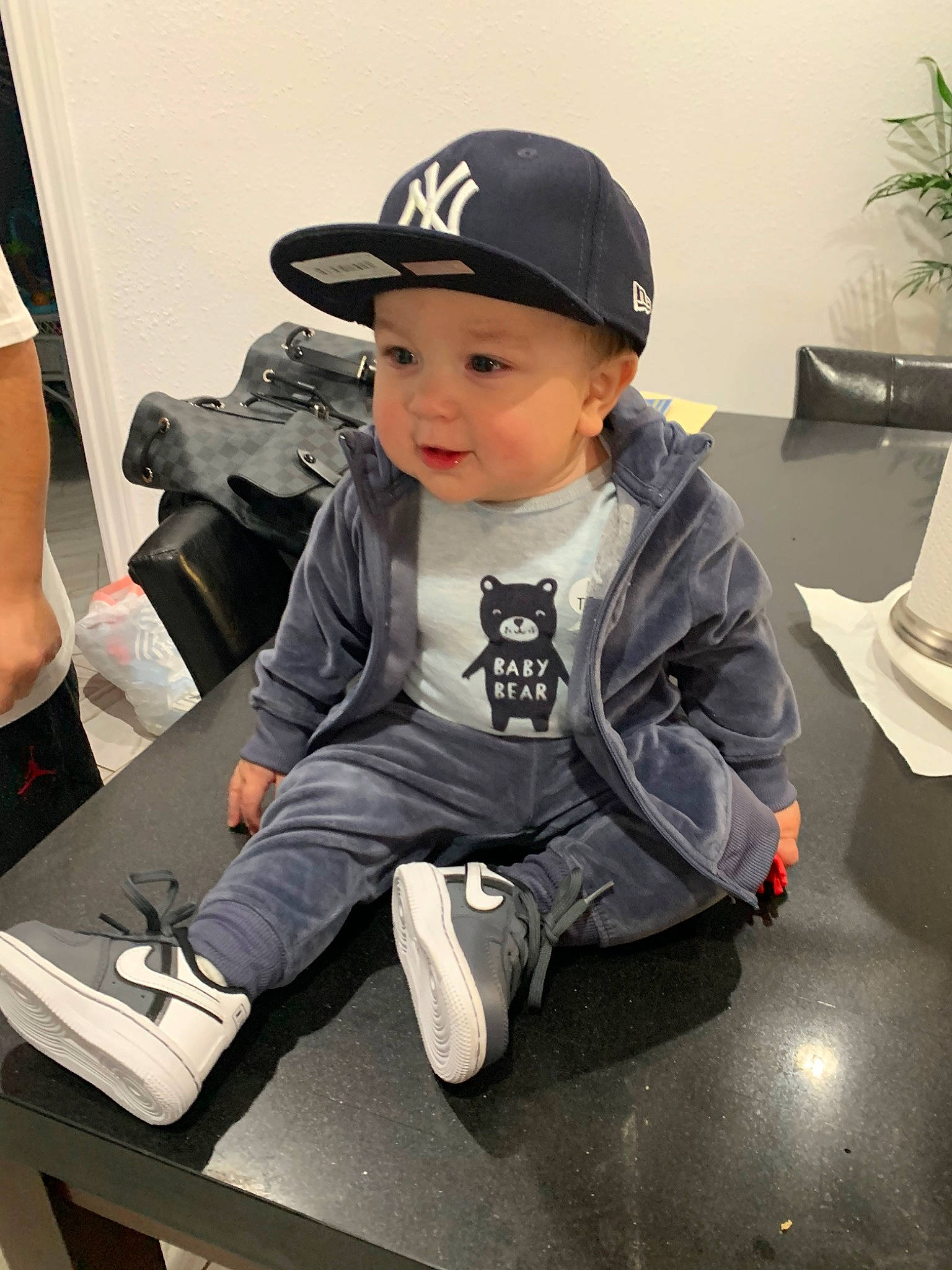 Nubric joined the competition — help win amazing prizes! baseball_cap, cap, child, fashion_accessory, hat, headgear, headwear, outerwear, person, play, shoe, sitting, sleeve, t_shirt, toddler