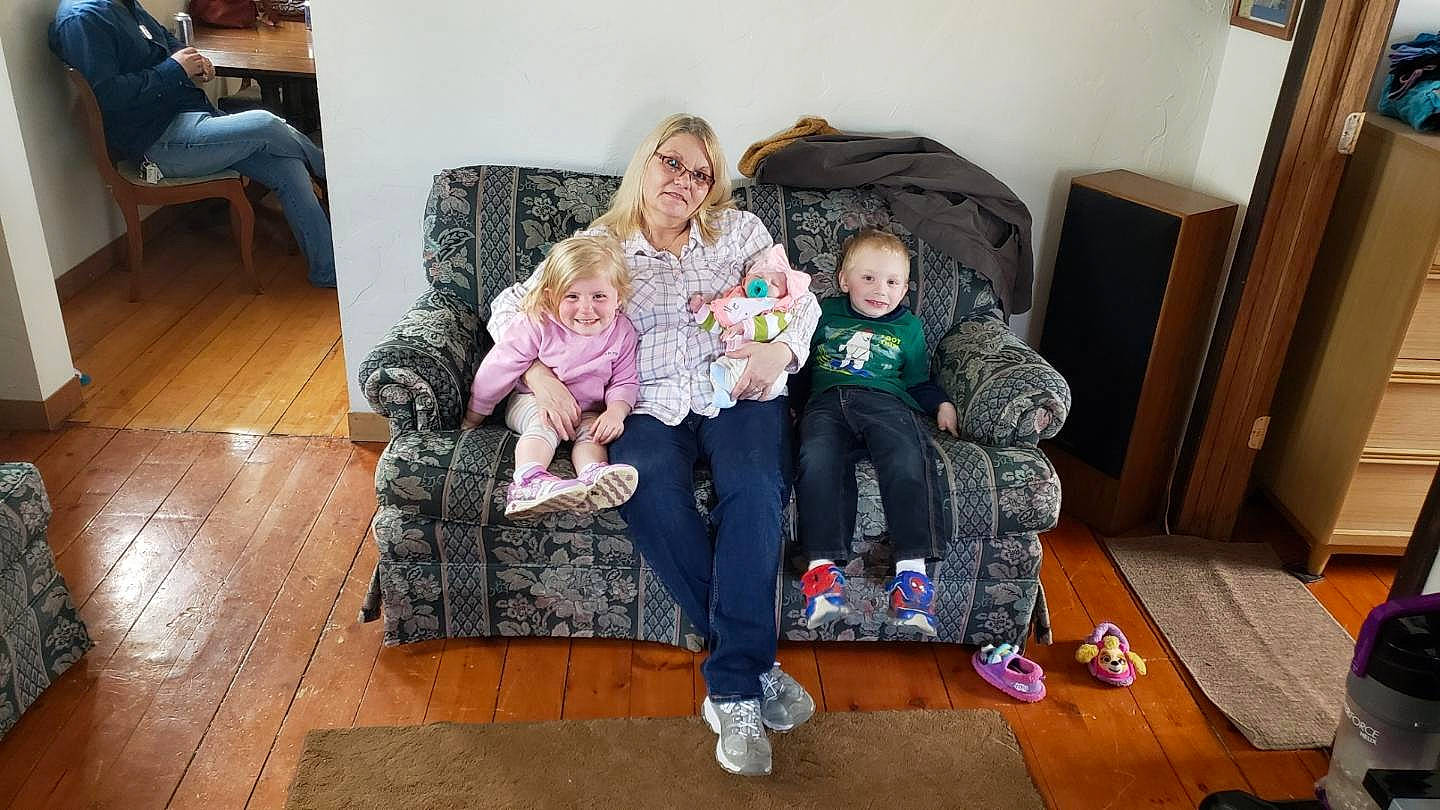 Jupiter is registered to the contest to win money with this photo: child, couch, daughter, family, furniture, joy, lap, person, sitting, toddler