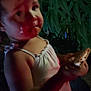Serenity is registered to the contest to win money with this photo: child, toddler, person, face, food, snack, leaf, plant, night, dark, outdoor, clothing, sleeveless, holding, young, portrait, greenery, blurred, light, shadow