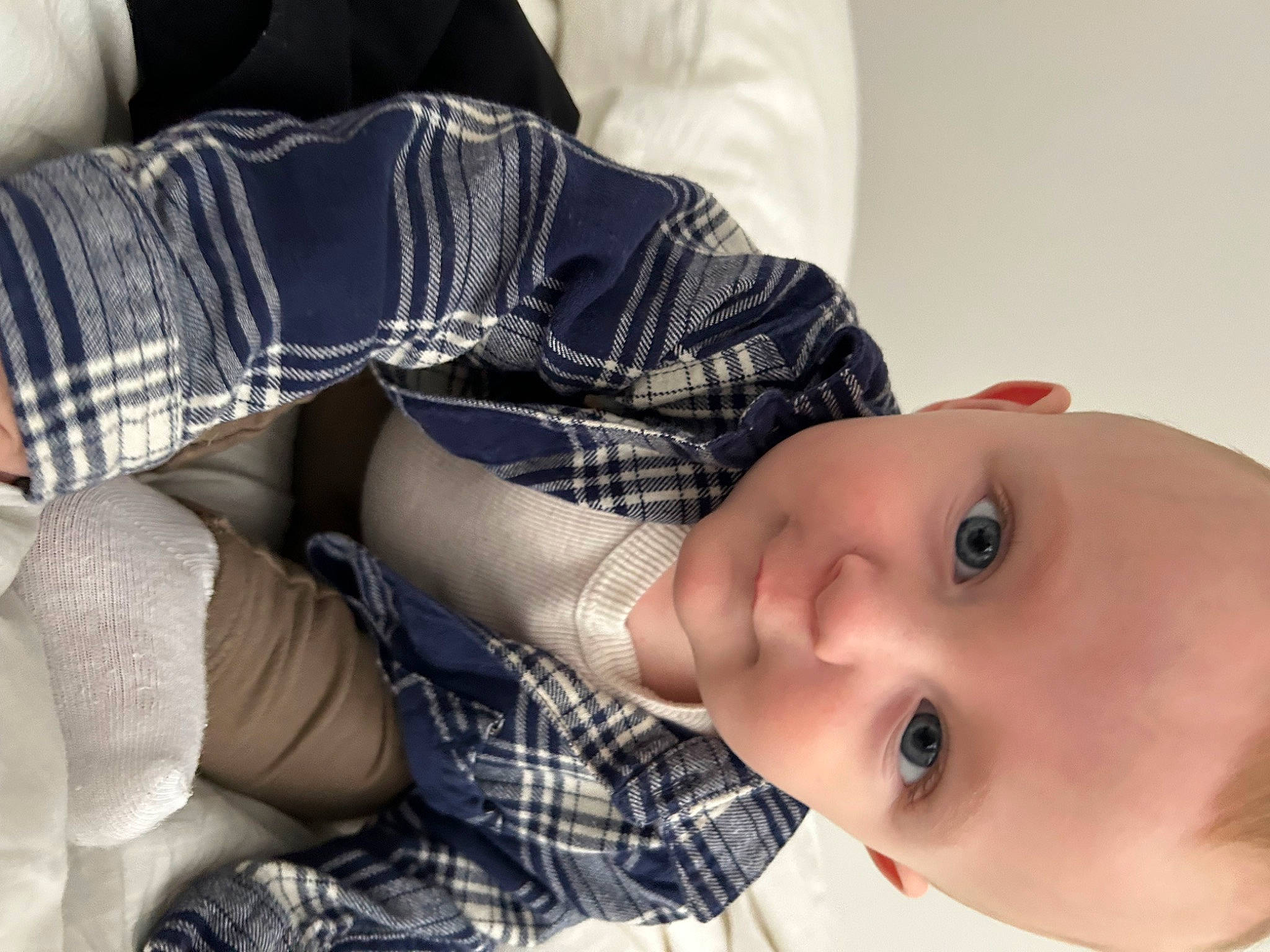 Graeson is registered to the contest to win money with this photo: baby, child, comfort, elbow, eyelash, human, human_leg, knee, lip, mouth, nose, pattern, people, person, plaid, skin, sleeve, tartan, textile, thigh