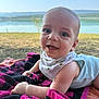 élio participe au concours pour gagner de l'argent avec cette photo : baby, child, clothing, cute, eyes, face, grass, happy, head, infant, lake, nature, outdoor, portrait, scenery, smiling, summer, sunlight, towel, water