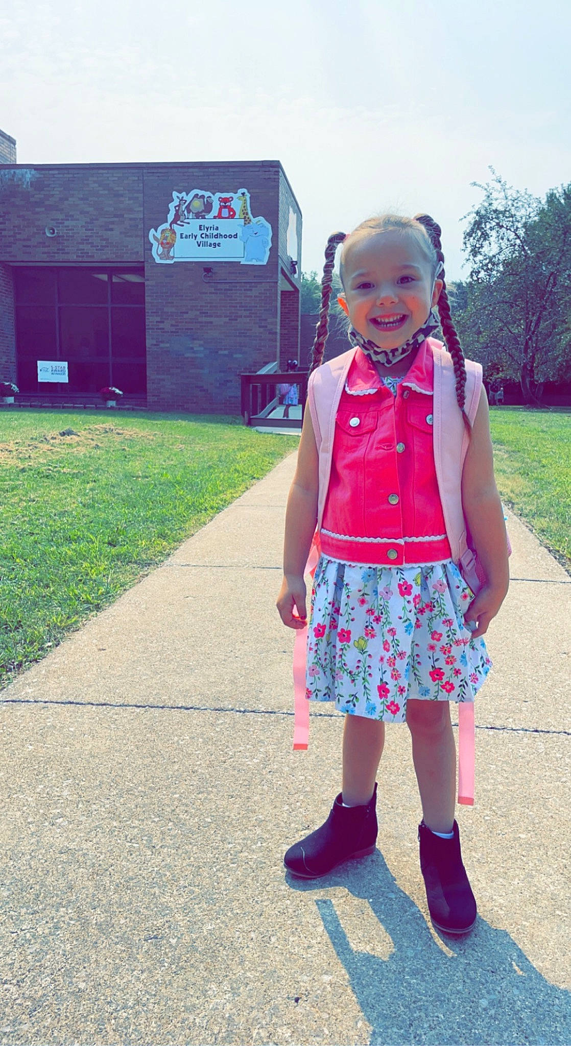 Angelina is registered to the contest to win money with this photo: asphalt, denim, electric_blue, fun, grass, happy, human_body, joy, leisure, magenta, outerwear, person, pink, plaid, plant, recreation, sky, sleeve, smile, tartan