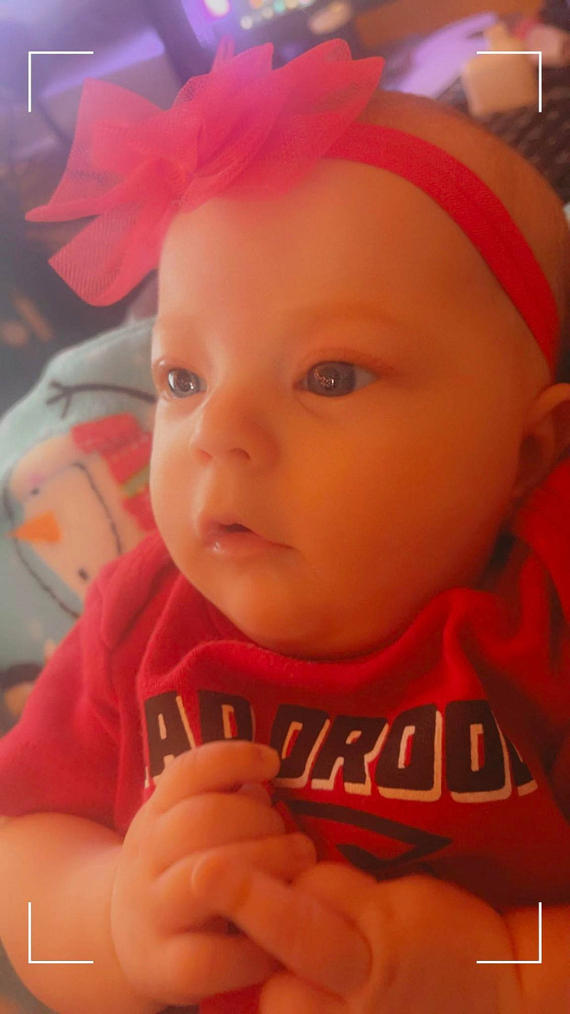 Lillian is registered to the contest to win money with this photo: baby, cheek, chin, cool, ear, eye, eyebrow, eyelash, forehead, hairstyle, headgear, iris, lip, mouth, nose, orange, organ, person, pink, skin