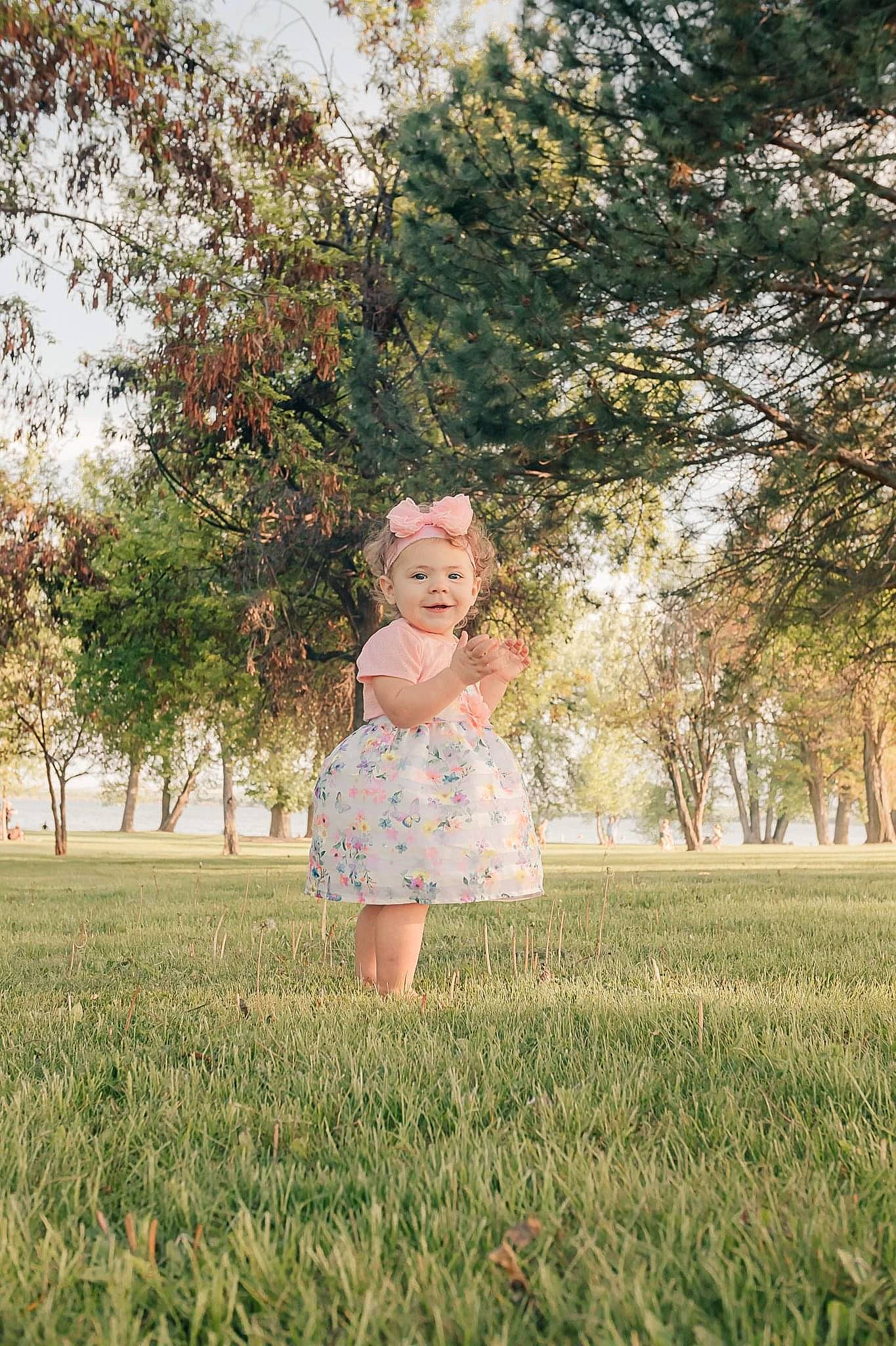 Mattie is registered to the contest to win money with this photo: beauty, blond, child, dress, eye, grass, grass_family, green, headwear, joy, leaf, meadow, people_in_nature, person, photograph, photography, plant, smile, spring, standing