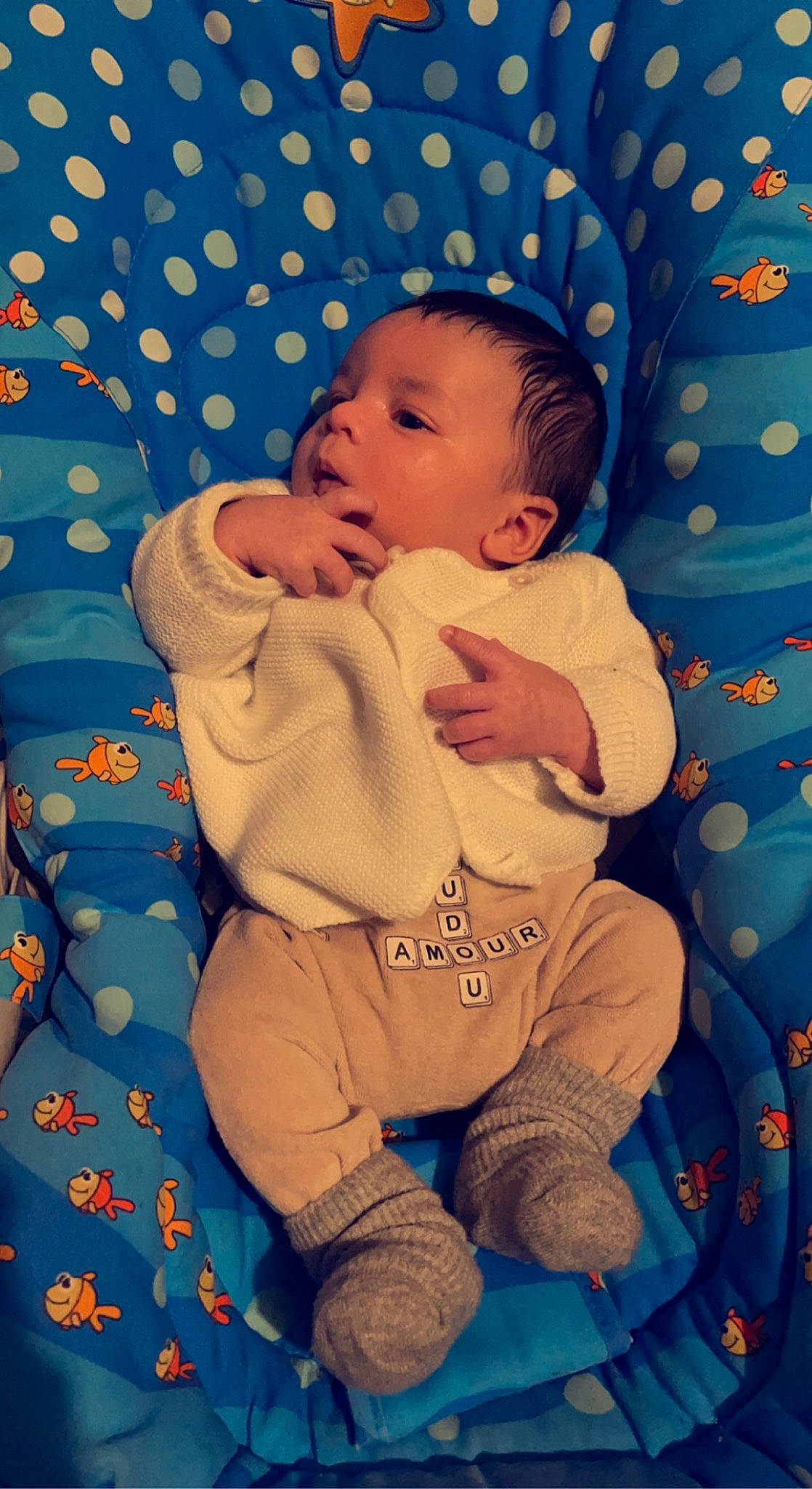 Isaak participe au concours pour gagner de l'argent avec cette photo : baby, baby_products, baby_sleeping, baby_toddler_clothing, blue, cheek, child, comfort, electric_blue, eye, finger, happy, head, linens, nose, pattern, person, skin, sleeve, textile