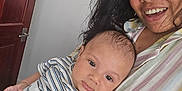 Ignacio joined the competition — help win amazing prizes! baby, bib, casual, child, door, face, family, hair, happy, holding, indoor, infant, love, onesie, person, portrait, skin, smile, striped_clothing, woman