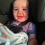 baby, child, car_seat, blanket, smile, teeth, sunlight, shadow, purple_shirt, infant, seatbelt, cute, happy, indoor, portrait, close_up, person, young_child, warm_light, cozy