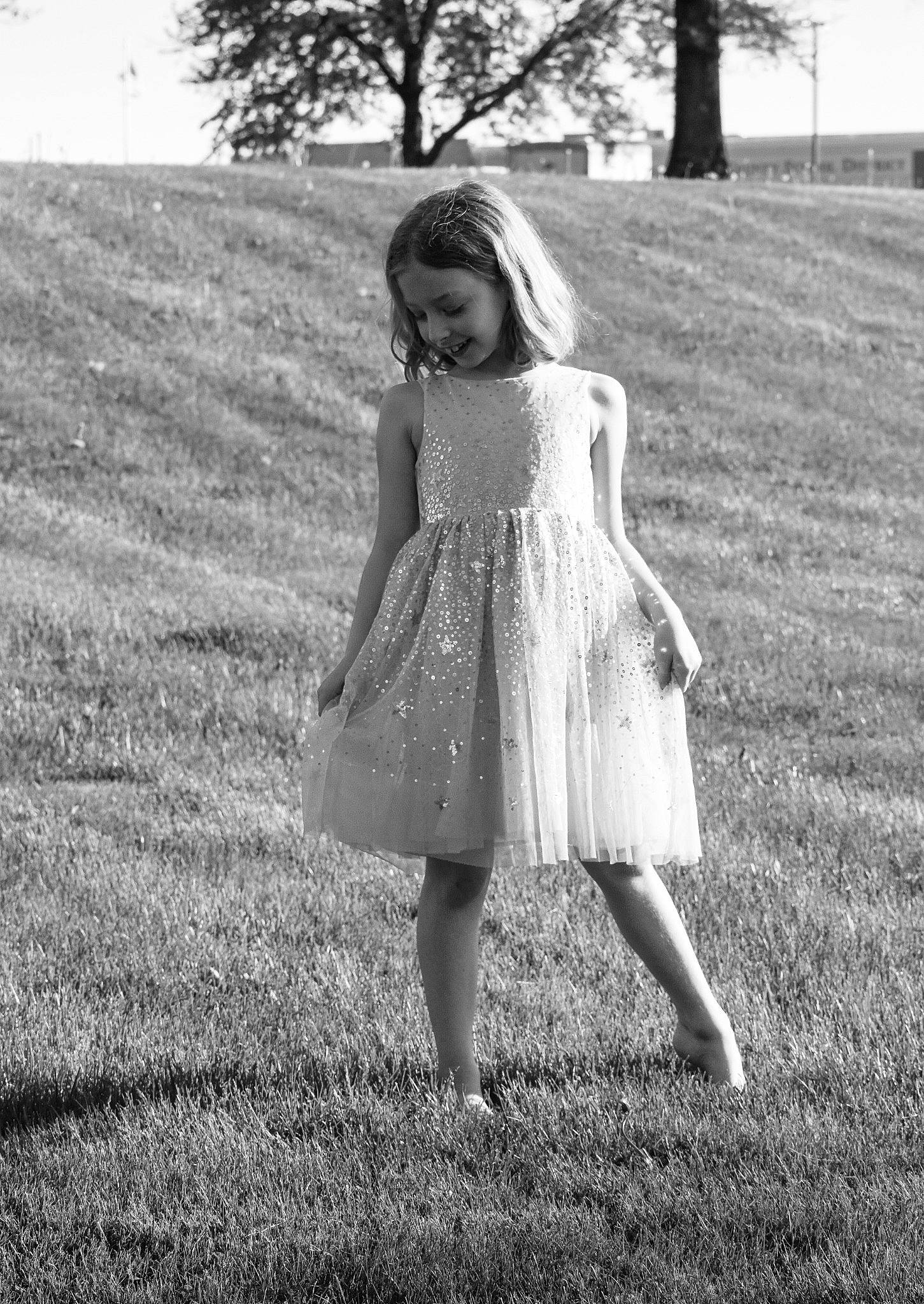 Camryn is registered to the contest to win money with this photo: day_dress, dress, flash_photography, gesture, grass, grass_family, grassland, happy, human_leg, joy, long_hair, meadow, monochrome, monochrome_photography, people_in_nature, person, plant, style, sunlight, tints_and_shades