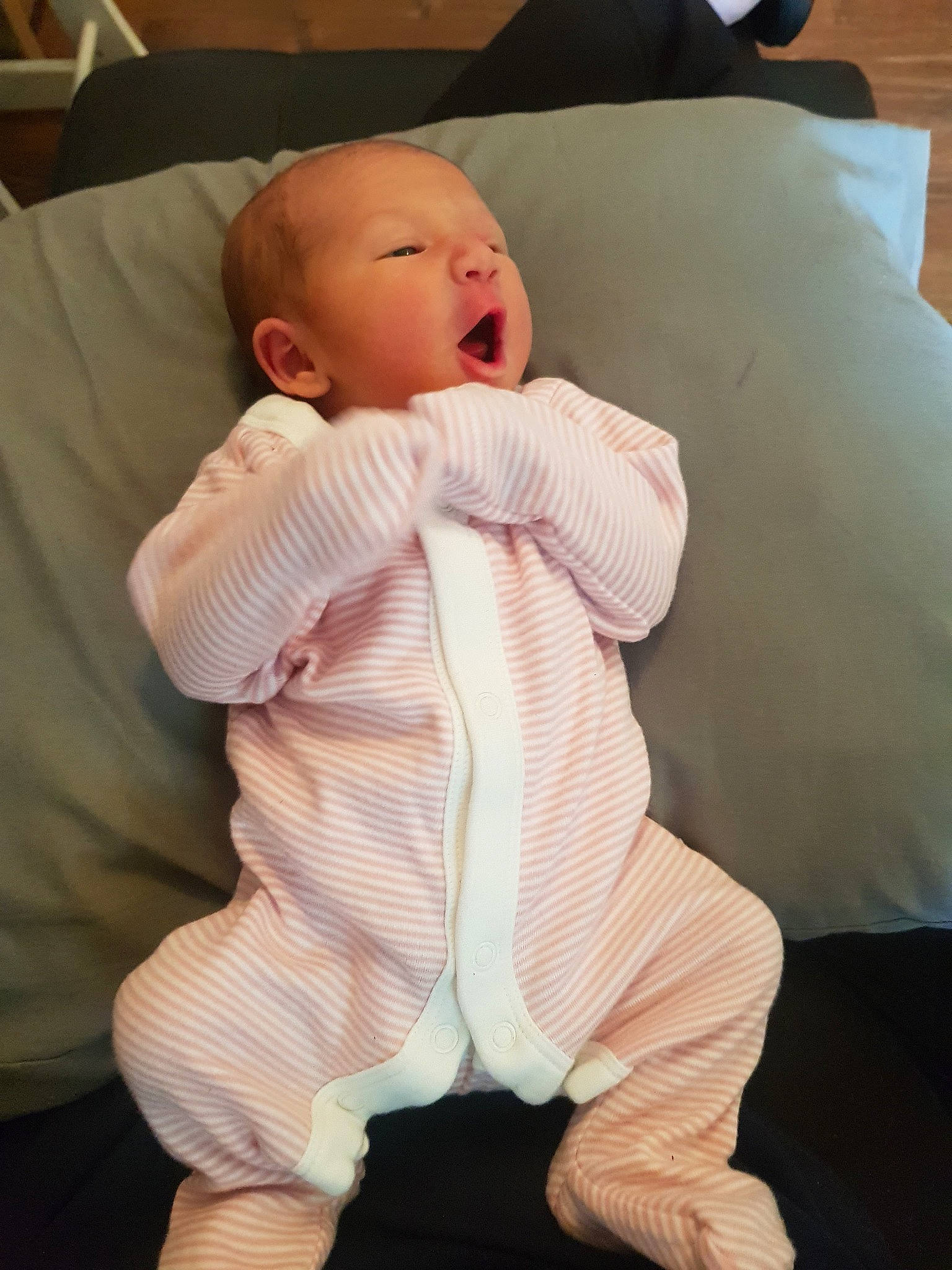 Emilee is registered to the contest to win money with this photo: baby, baby_toddler_clothing, cheek, child, comfort, head, leg, person, pink, skin, sleeve, smile, toddler