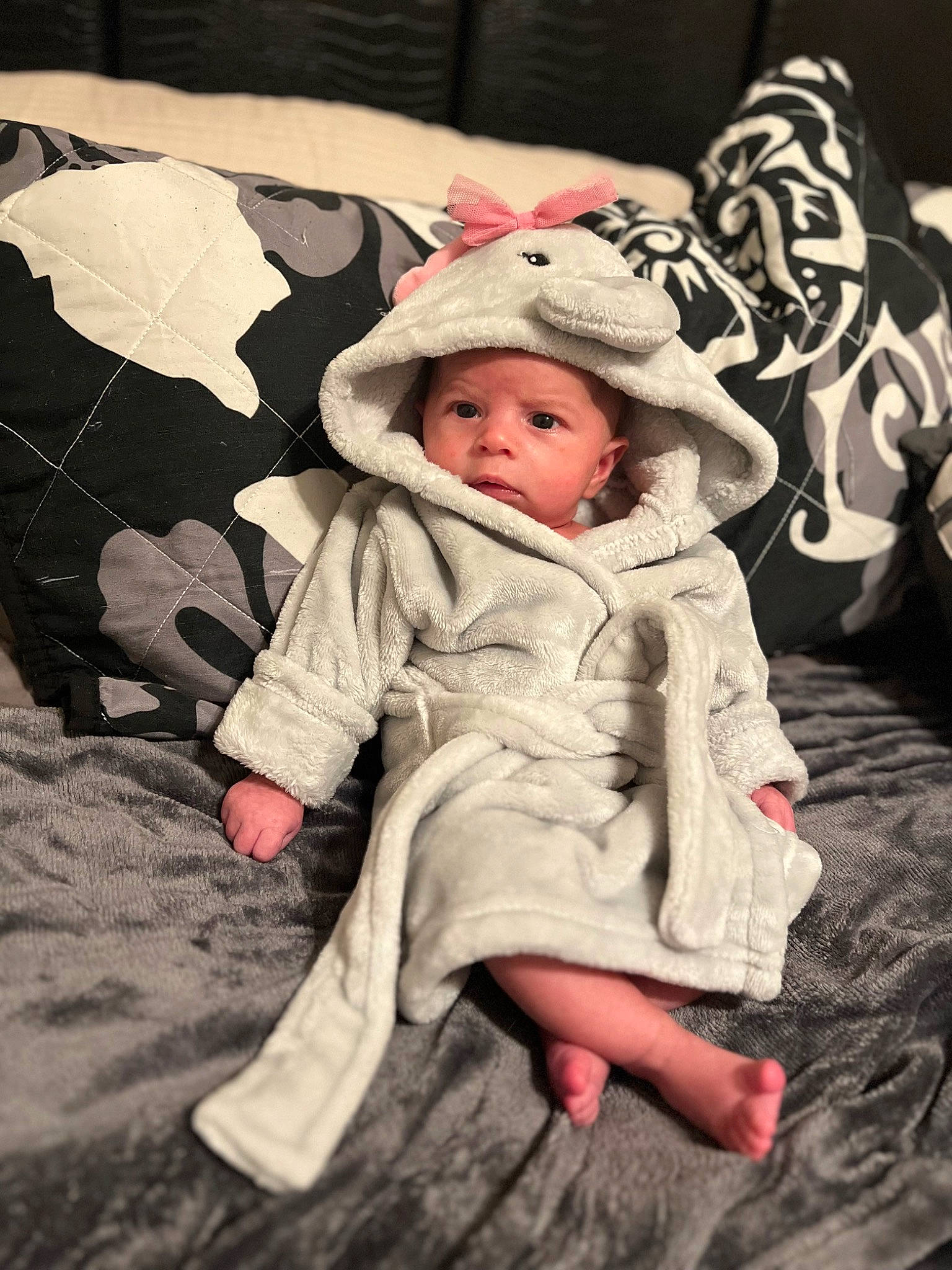 Ailani is registered to the contest to win money with this photo: baby, baby_toddler_clothing, cap, child, comfort, fashion_accessory, flooring, fun, fur, grass, happy, headwear, linens, pattern, person, portrait_photography, room, sitting, sleeve, toddler