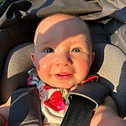 Harper joined the competition — help win amazing prizes! baby, child, smiling, car_seat, seatbelt, sunlight, shadow, face, portrait, happy, infant, cute, clothing, straps, outdoor, closeup, skin, head, person, daylight