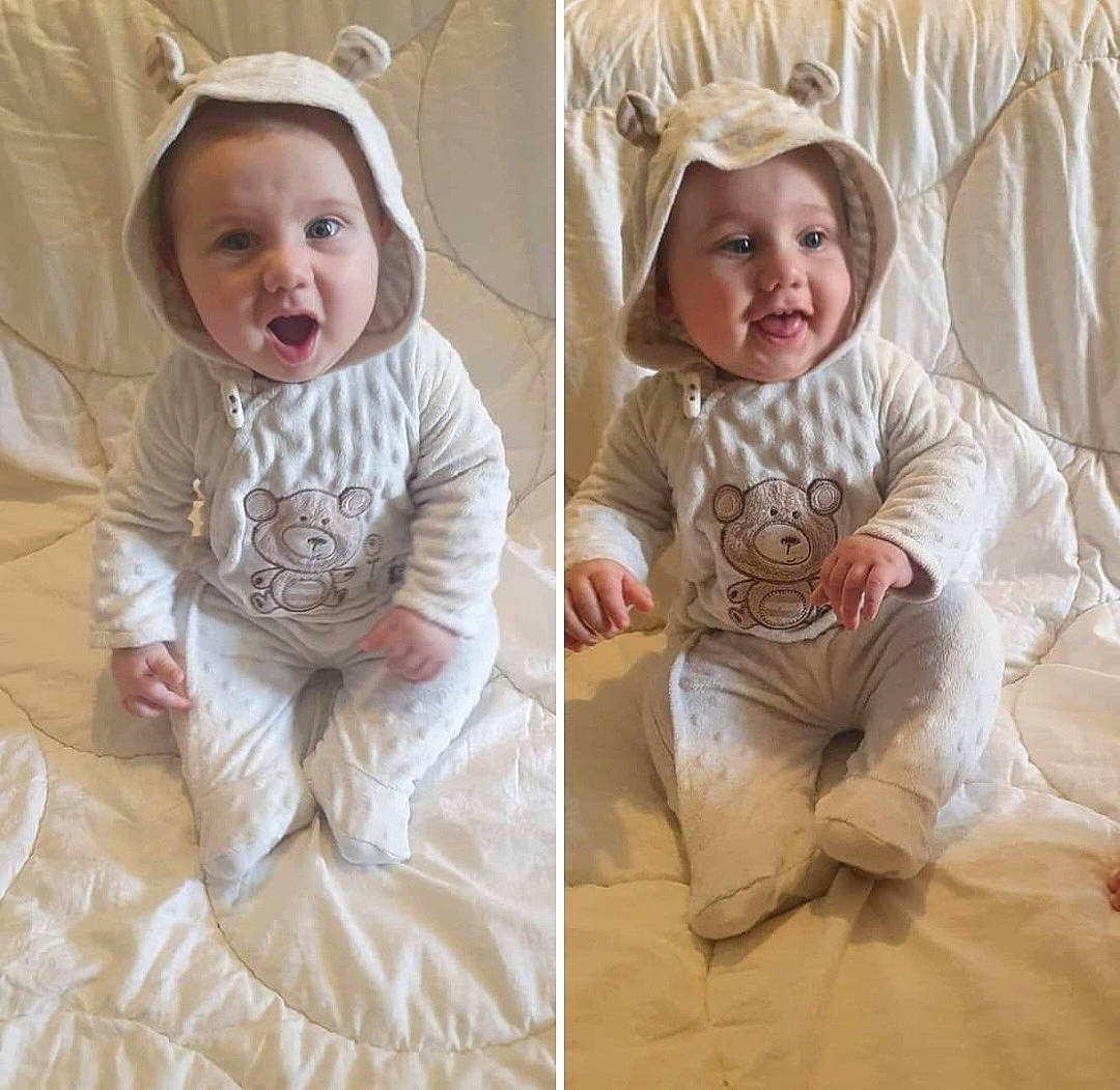 Atlus is registered to the contest to win money with this photo: baby, baby_toddler_clothing, child, collar, comfort, eye, face, fashion_accessory, happy, head, headgear, headwear, linens, pattern, person, portrait_photography, skin, sleeve, smile, t_shirt