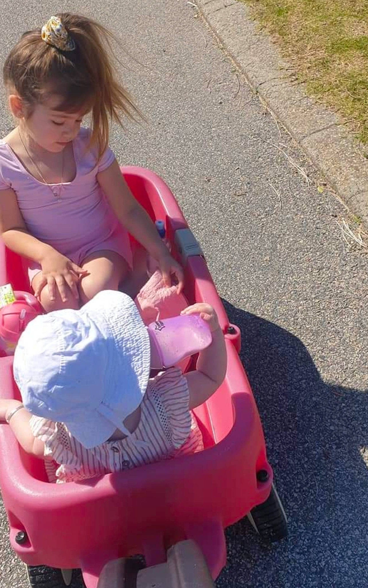 Khalissia is registered to the contest to win money with this photo: asphalt, baby, baby_carriage, baby_products, baby_toddler_clothing, child, comfort, fun, hair, lap, leisure, magenta, person, pink, recreation, sitting, tar, tire, toddler, travel