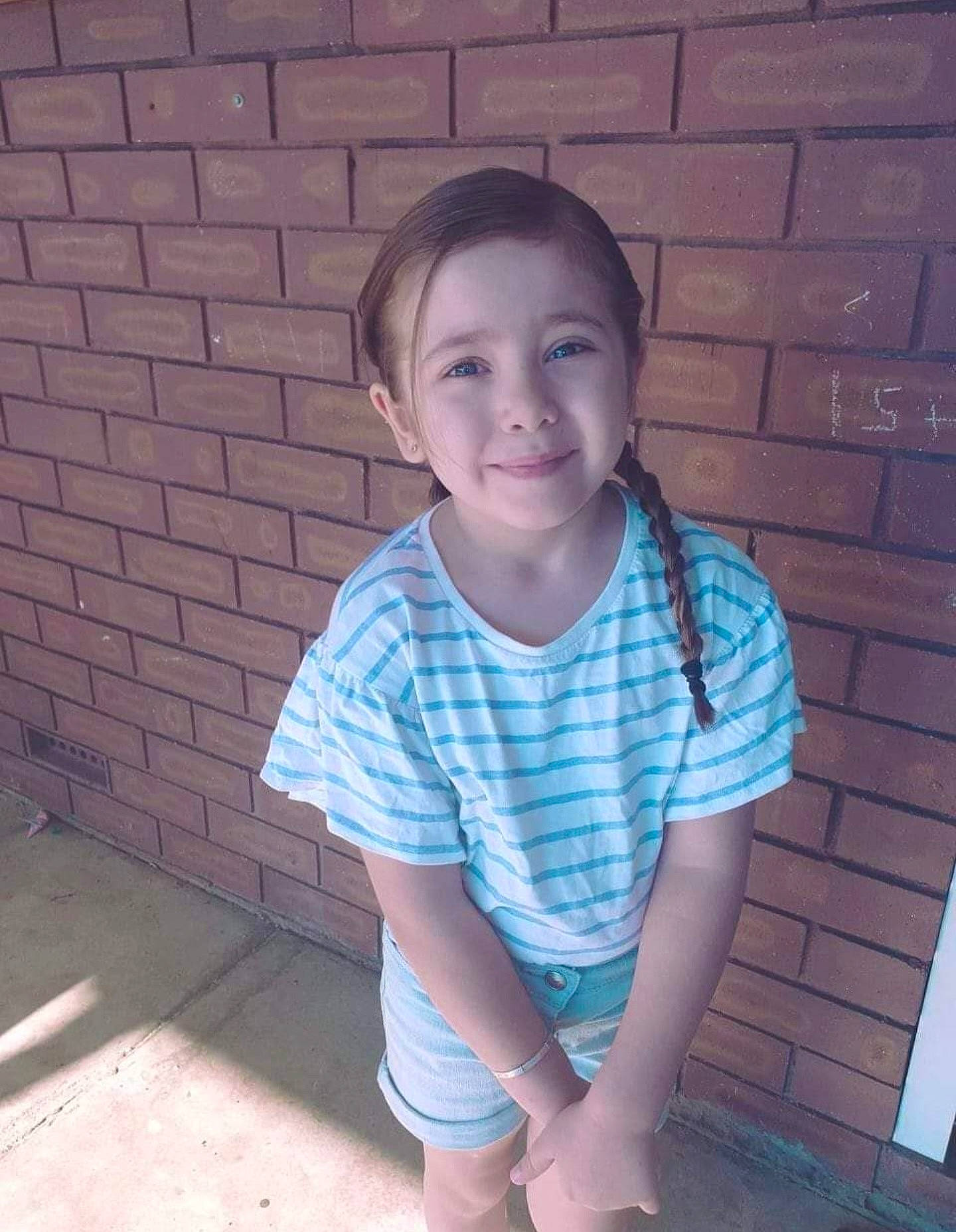 Khalissia is registered to the contest to win money with this photo: baby_toddler_clothing, brick, cool, electric_blue, face, flash_photography, flooring, happy, human_body, joy, mouth, neck, nose, person, plaid, shirt, skin, sleeve, smile, t_shirt