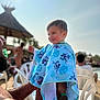 toddler, child, smiling, towel, blue, adult, hand, sunlight, outdoor, poolside, chair, thatched_umbrella, people, summer, happy, portrait, daylight, vacation, fun, skin
