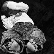 Mateo joined the competition — help win amazing prizes! baby, infant, feet, denim_pants, long_sleeve_shirt, black_and_white, laying_down, cozy, soft_texture, child, cute, small, toes, clothing, covering_face, relaxed, portrait, indoor, young, sleeping_position