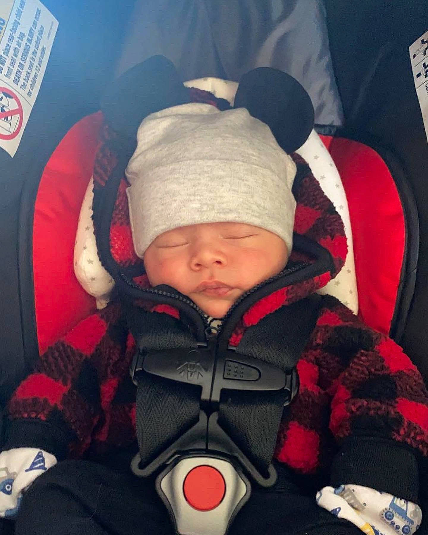 Preston is registered to the contest to win money with this photo: baby, baby_carriage, baby_products, baby_sleeping, baby_toddler_clothing, cap, car_seat, cheek, child, comfort, cool, fun, headwear, organ, outerwear, person, personal_protective_equipment, red, sleeve, textile