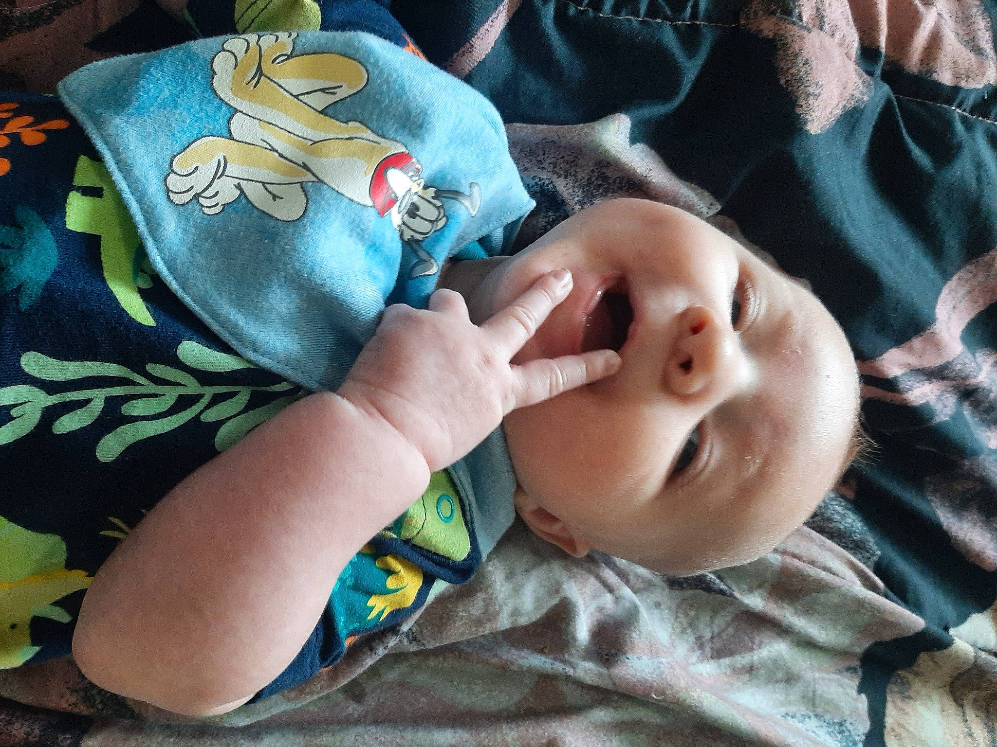 Chance is registered to the contest to win money with this photo: baby, baby_toddler_clothing, cheek, comfort, eye, facial_expression, finger, gesture, hand, head, linens, mammal, mouth, nose, person, product, skin, sleeve, textile, toddler