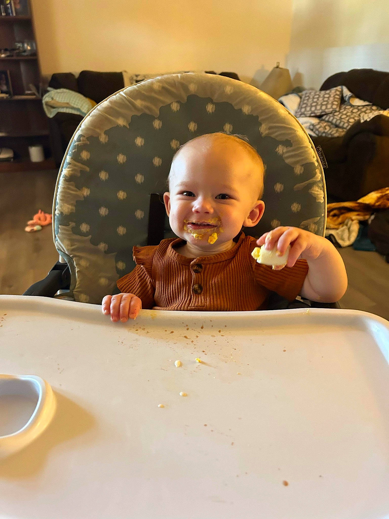Everleigh is registered to the contest to win money with this photo: baby, baby_laughing, baby_toddler_clothing, child, circle, dishware, fun, hairstyle, happy, joy, pattern, person, plate, serveware, sitting, sleeve, smile, t_shirt, table, tableware